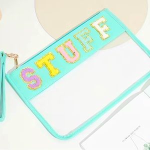 Plush letter clear bag “STUFF” w/ free Nuskin samples